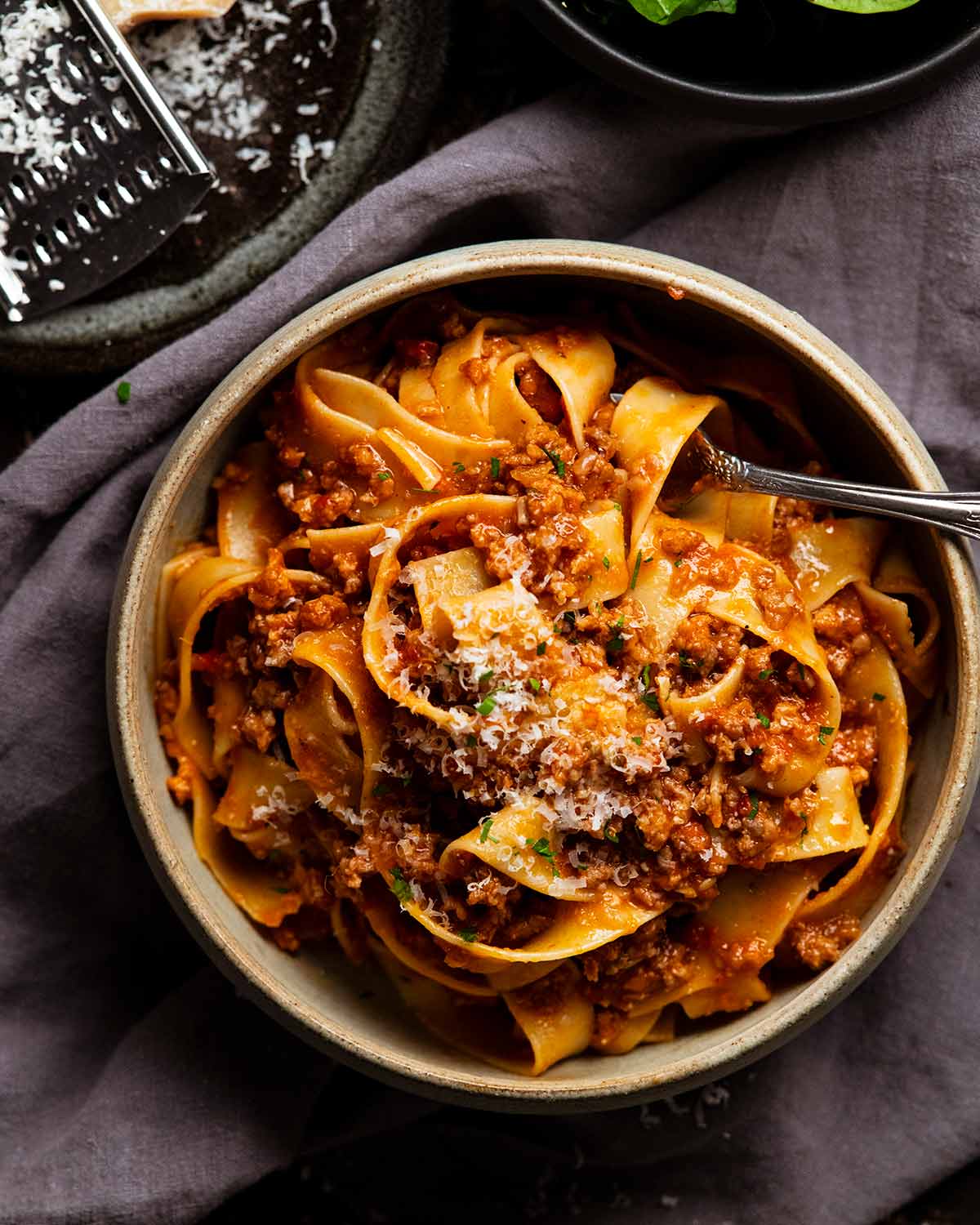 Sausage ragu pasta sauce with pappardelle in a bowl ready to be eaten