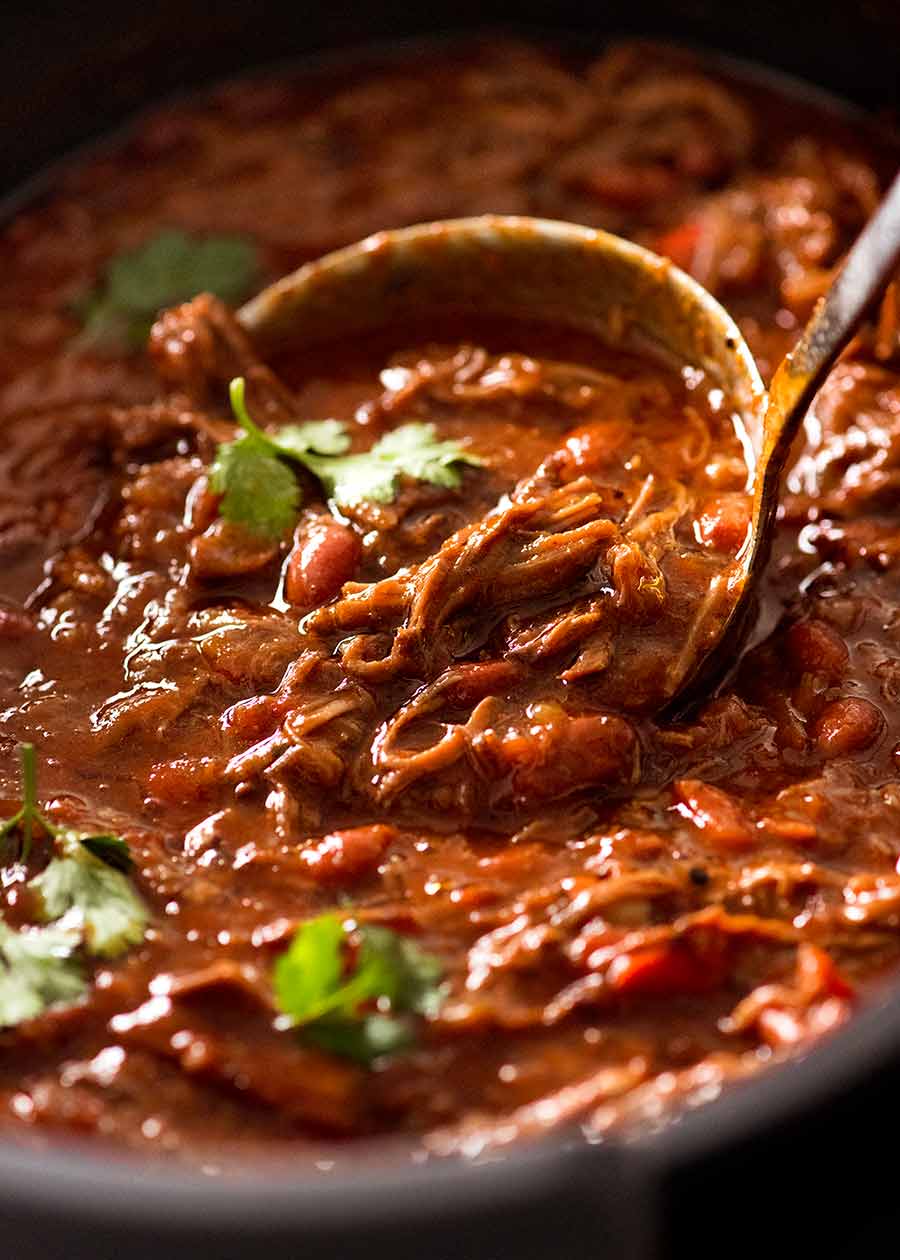 Close up of ladle scooping up Slow Cooker Shredded Beef Chili