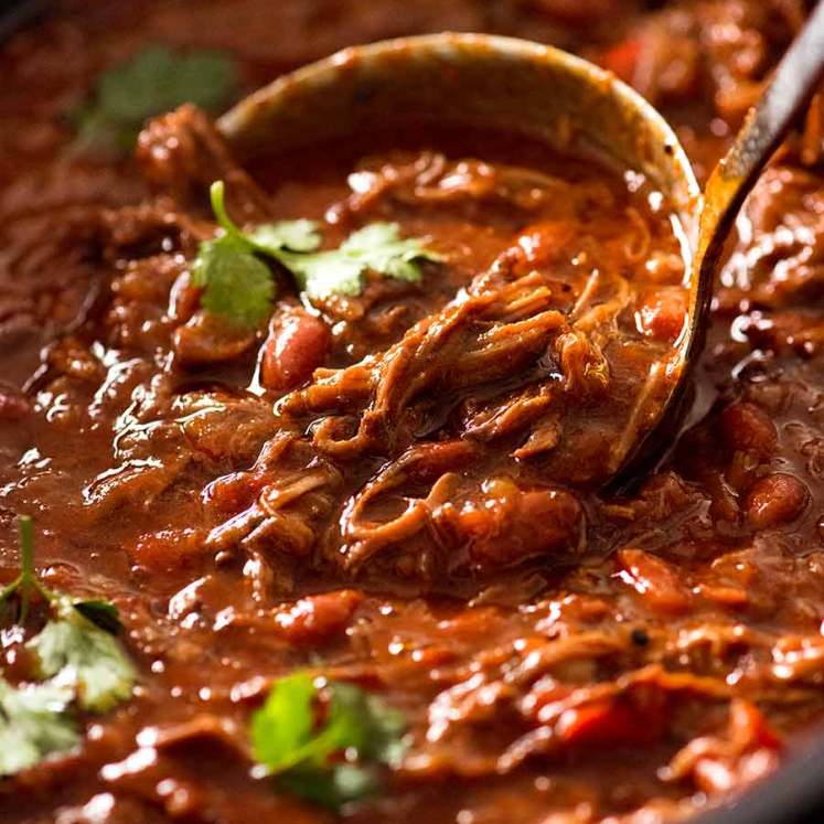 Close up of ladle scooping up Slow Cooker Shredded Beef Chili