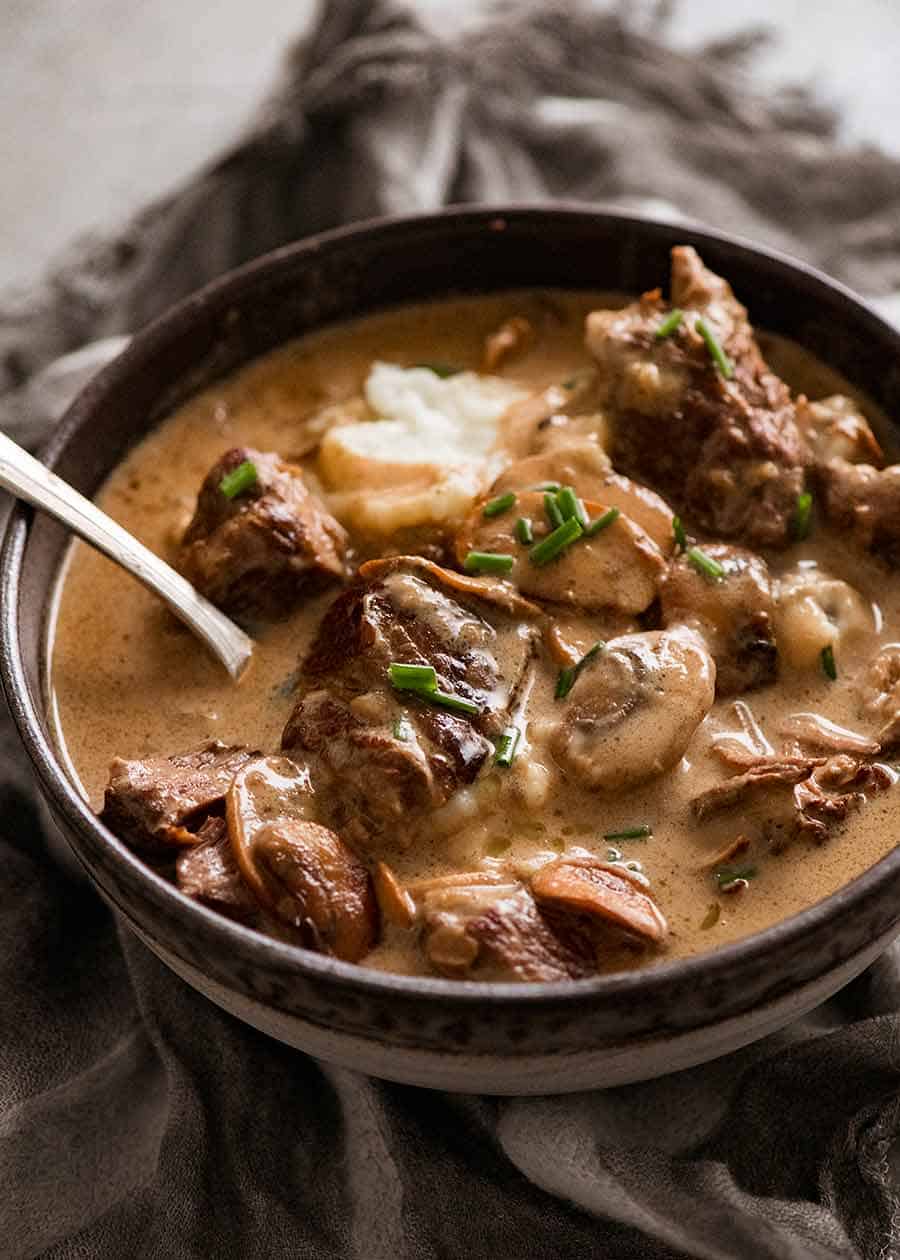 Slow Cooked Beef with Stroganoff Sauce served over mashed potato