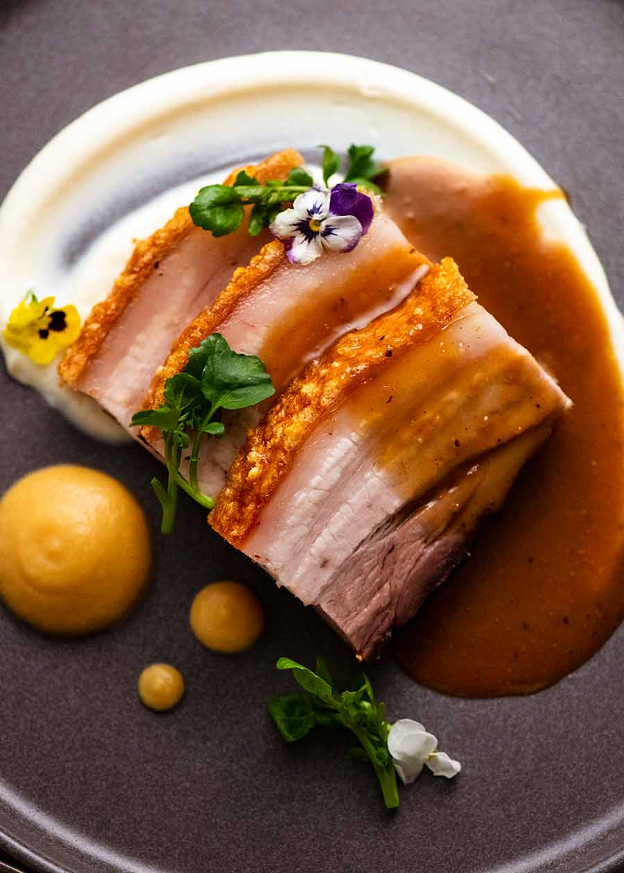 Fine dining restaurant plating of Slow Roasted Crispy Pork Belly