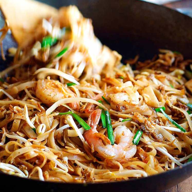 Tossing Shrimp Pad Thai in a wok