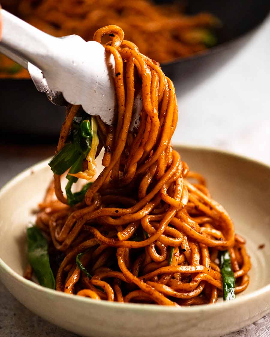 Placing Supreme Soy Noodles in a bowl