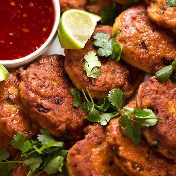 Close up photo of Thai Fish Cakes on a plate, ready to be eaten