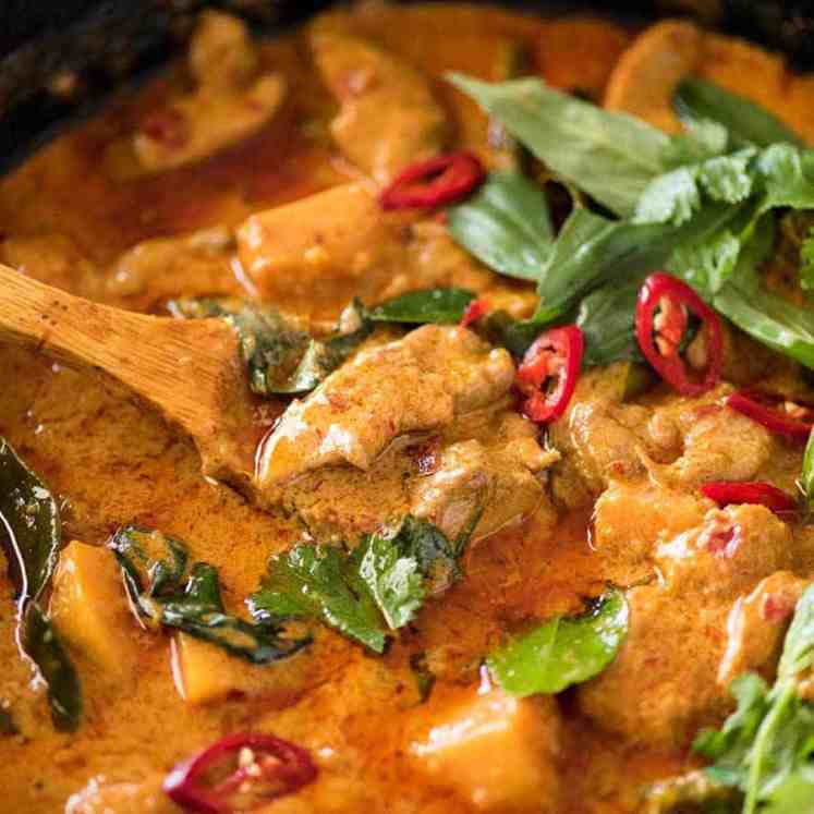 Thai Red Curry with Chicken in a skillet, fresh off the stove.