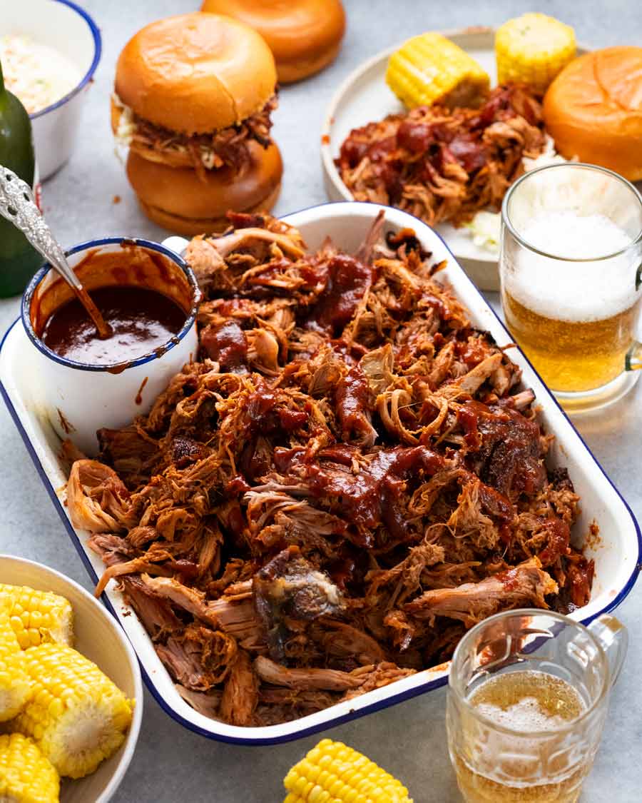 My best pulled pork in a pan with sides ready to be served