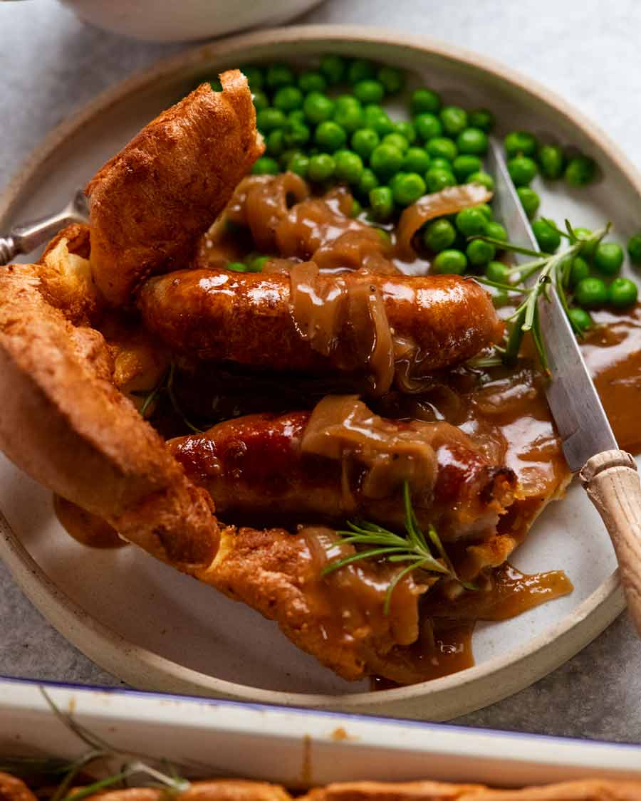 Plate of Toad in the hole ready to be eaten