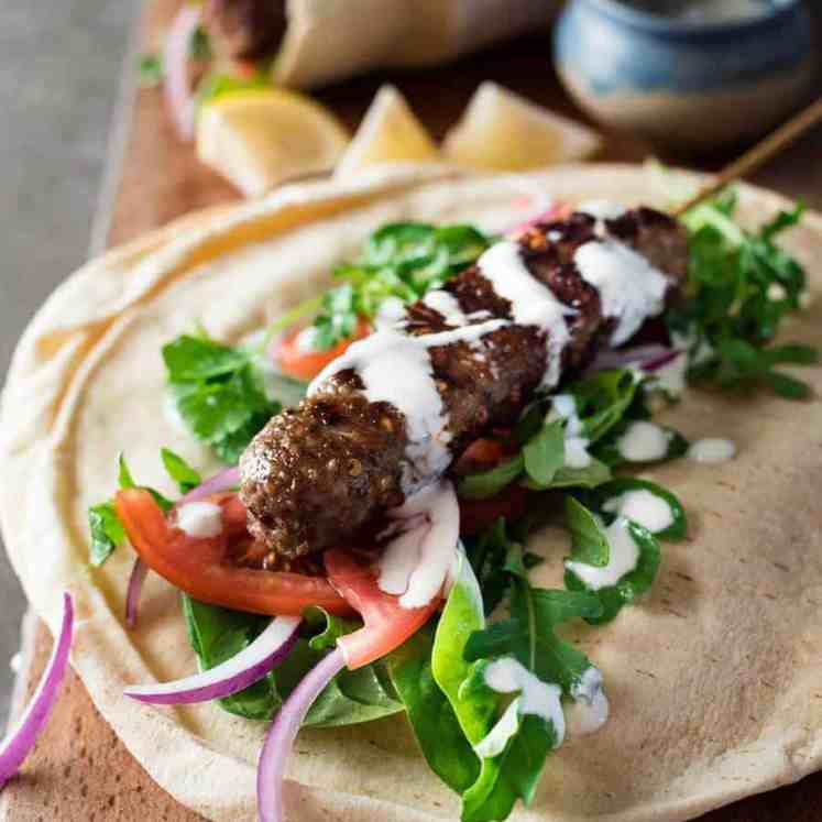 Turkish Lamb Kebab Kofta on pita with vegetables and yoghurt sauce