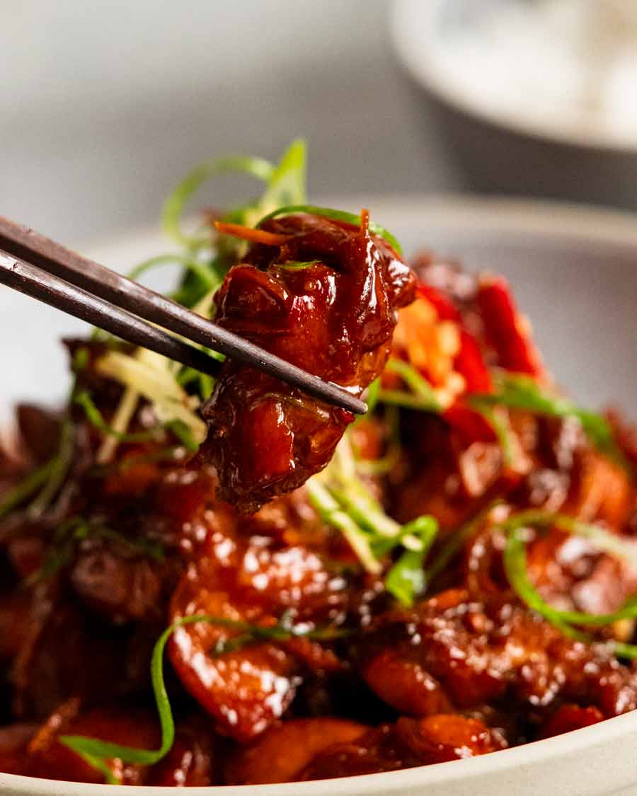 Close up of a piece of Vietnamese Caramel Ginger Chicken